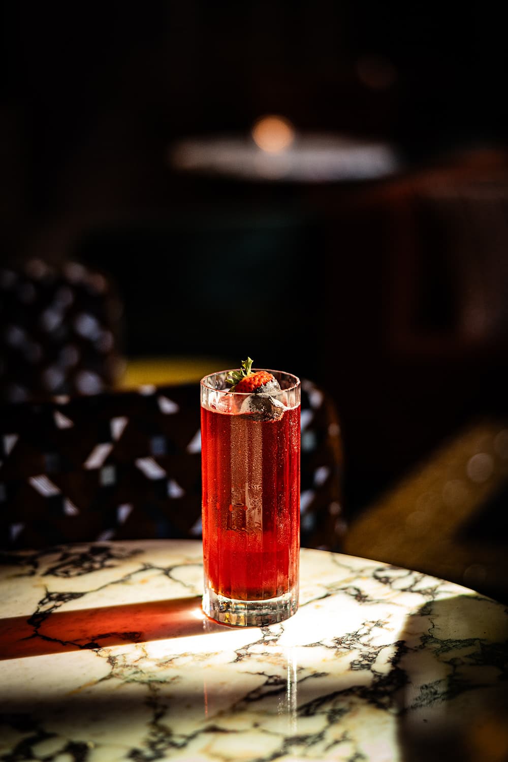 A fruity cocktails glows in sunlight