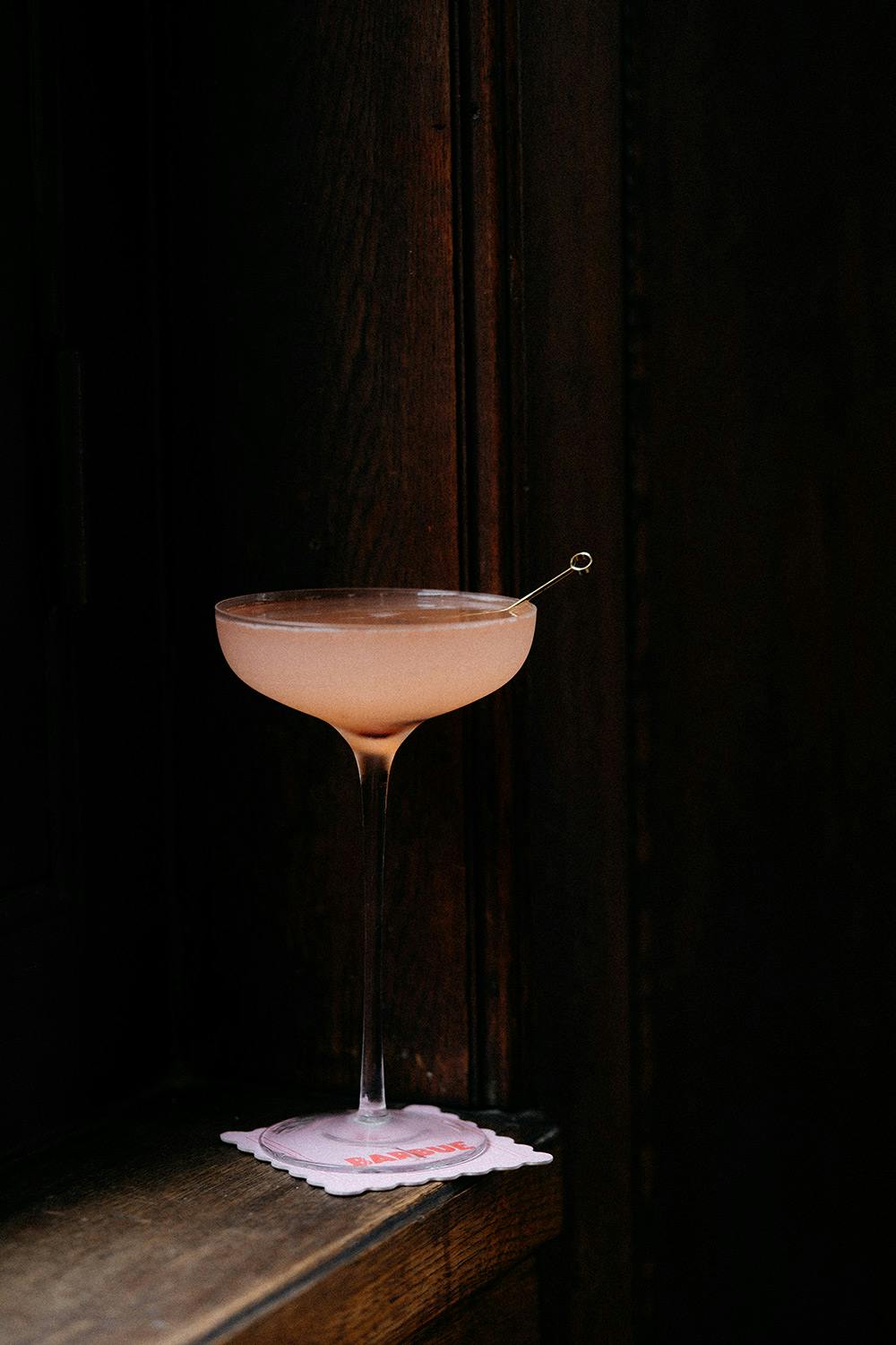 Pale cocktail in moody lighting